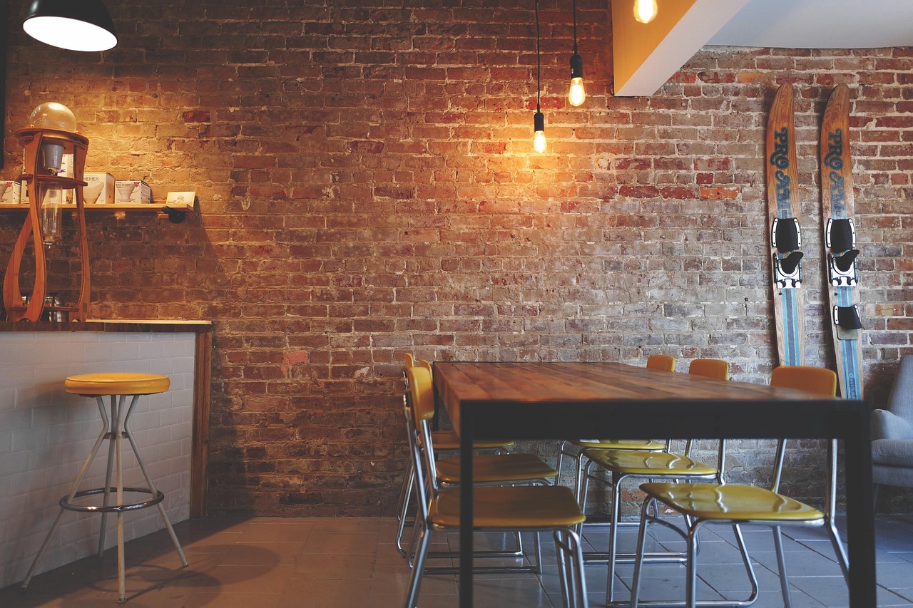 A table set with colorful seasonal dishes in a softly lit restaurant